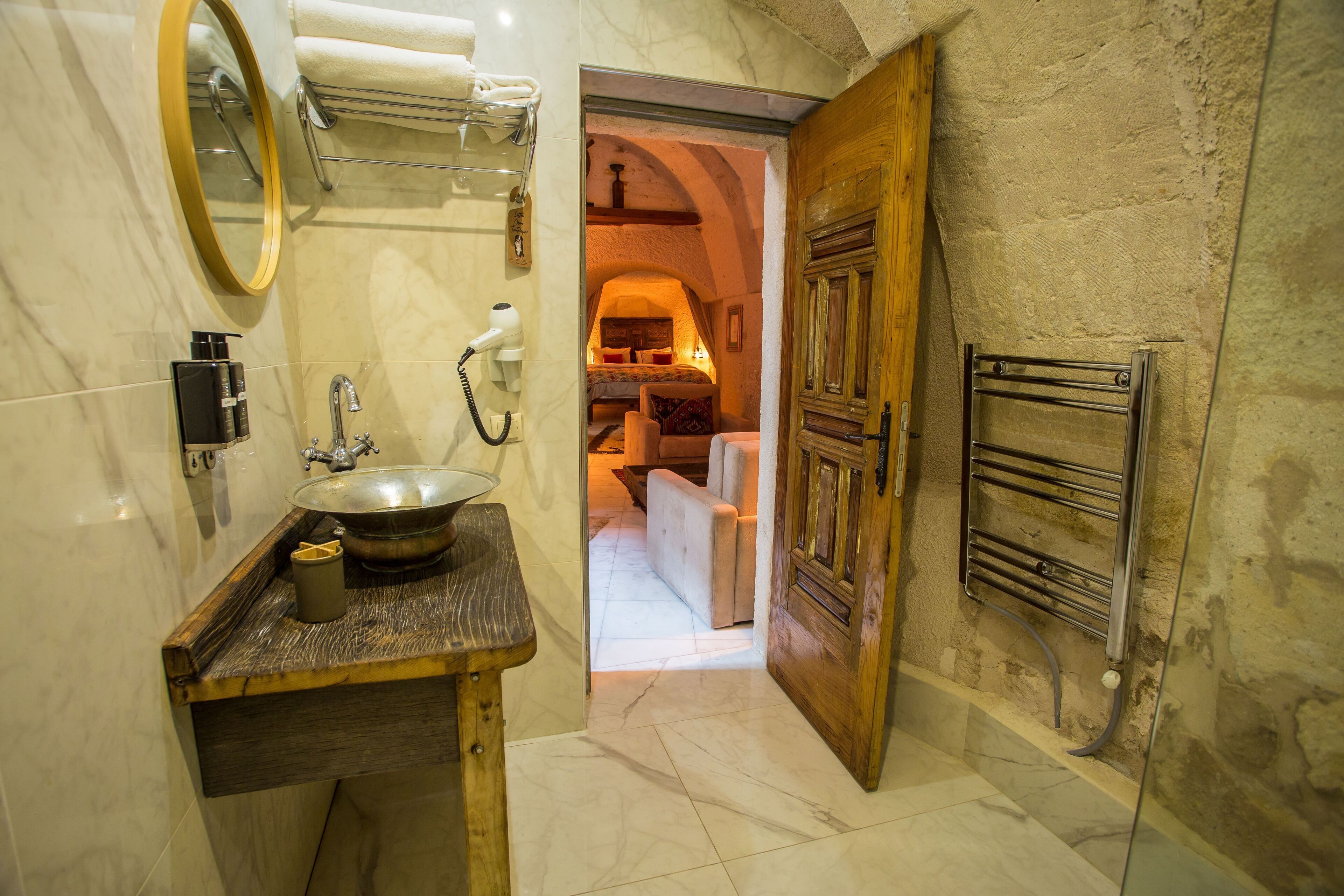 cave suite | bathroom | shower, hair dryer, slippers, towels
