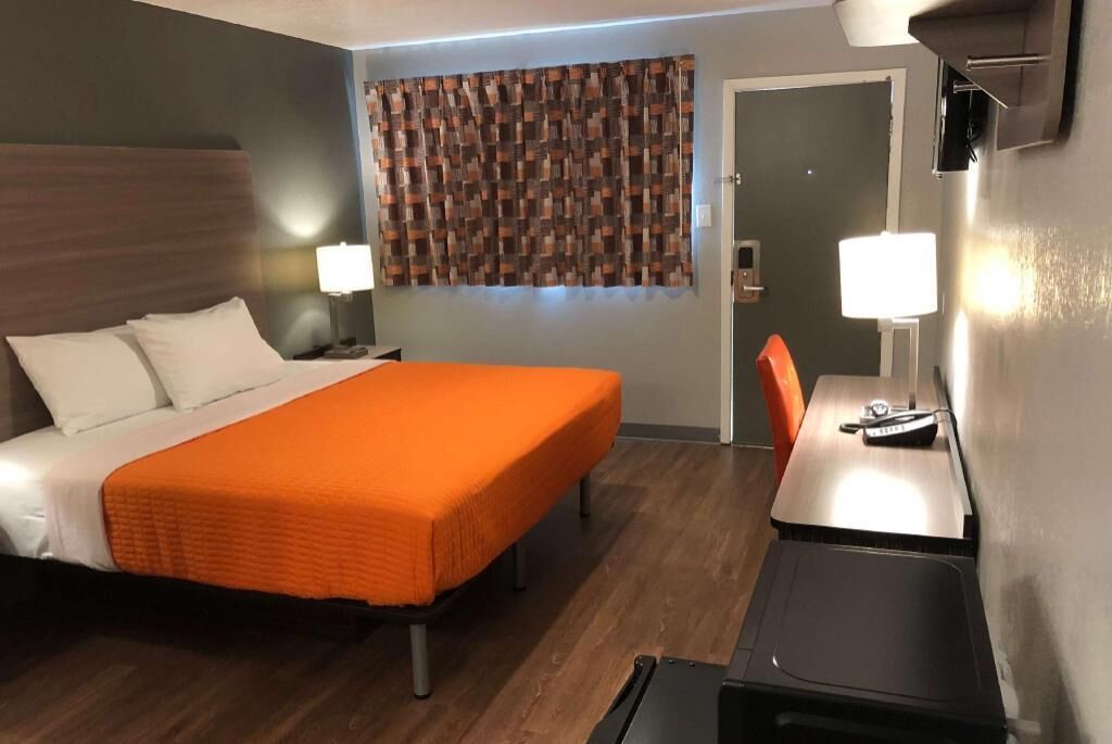 Premium bedding, desk, laptop workspace, free WiFi