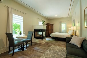 Comfort Suite, 1 King Bed (6) | Living area | Flat-screen TV, fireplace