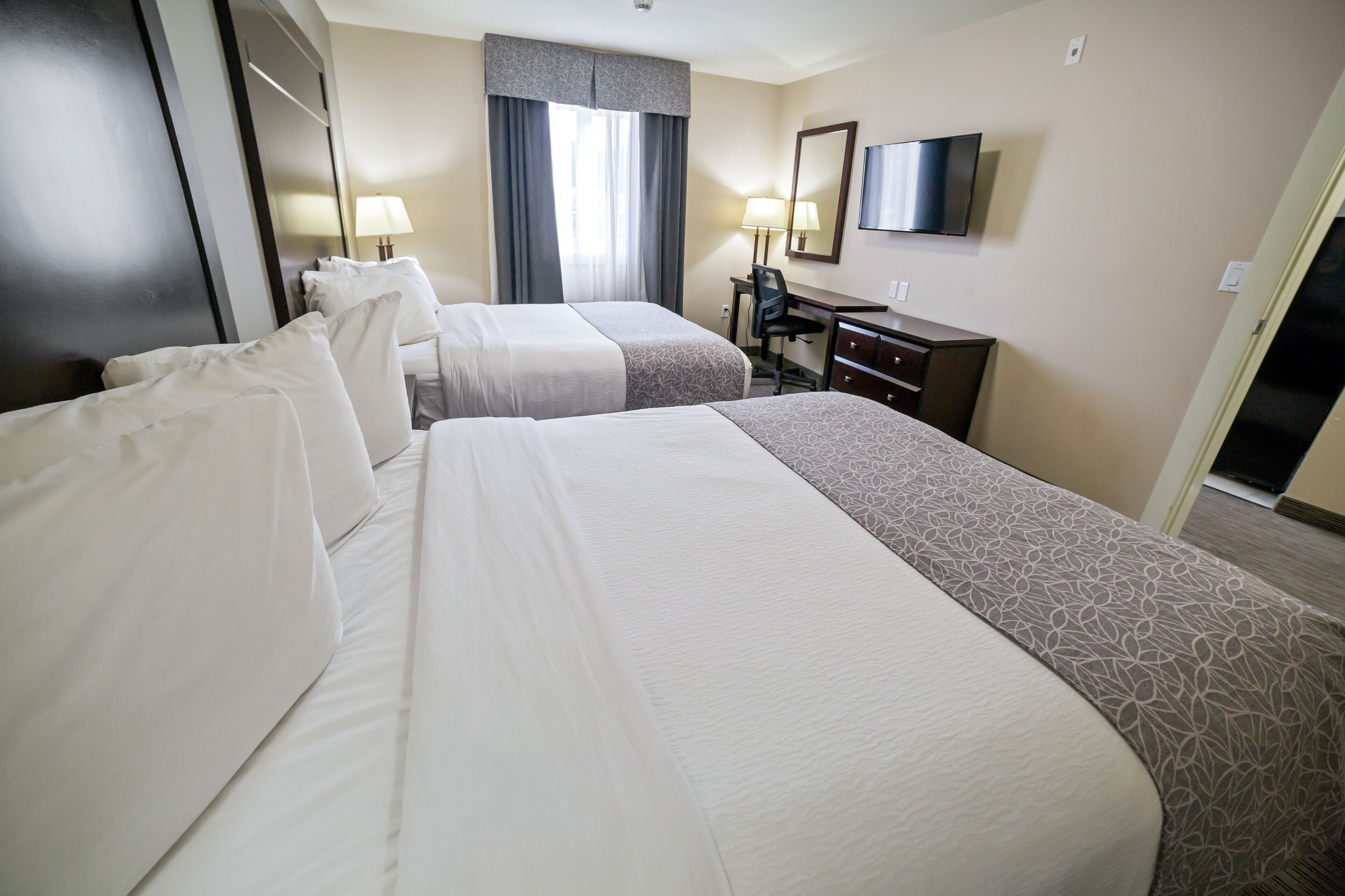 deluxe room, 2 queen beds, kitchenette | premium bedding, individually furnished, desk, laptop workspace