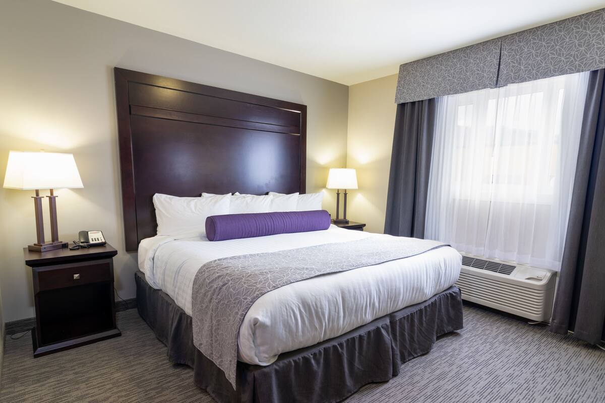 Premium bedding, desk, laptop workspace, iron/ironing board