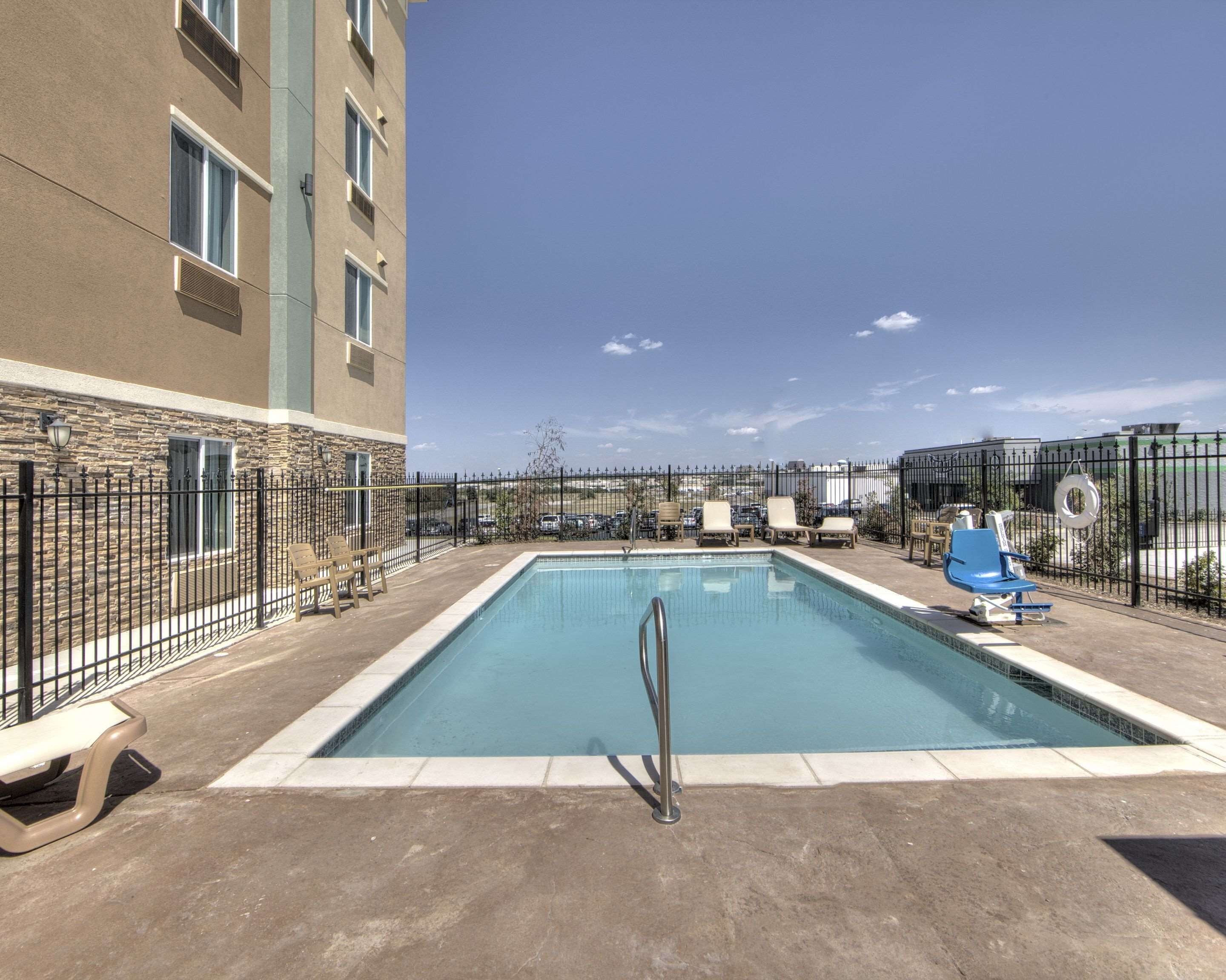 Seasonal outdoor pool, open 10:00 AM to 10:00 PM, pool umbrellas