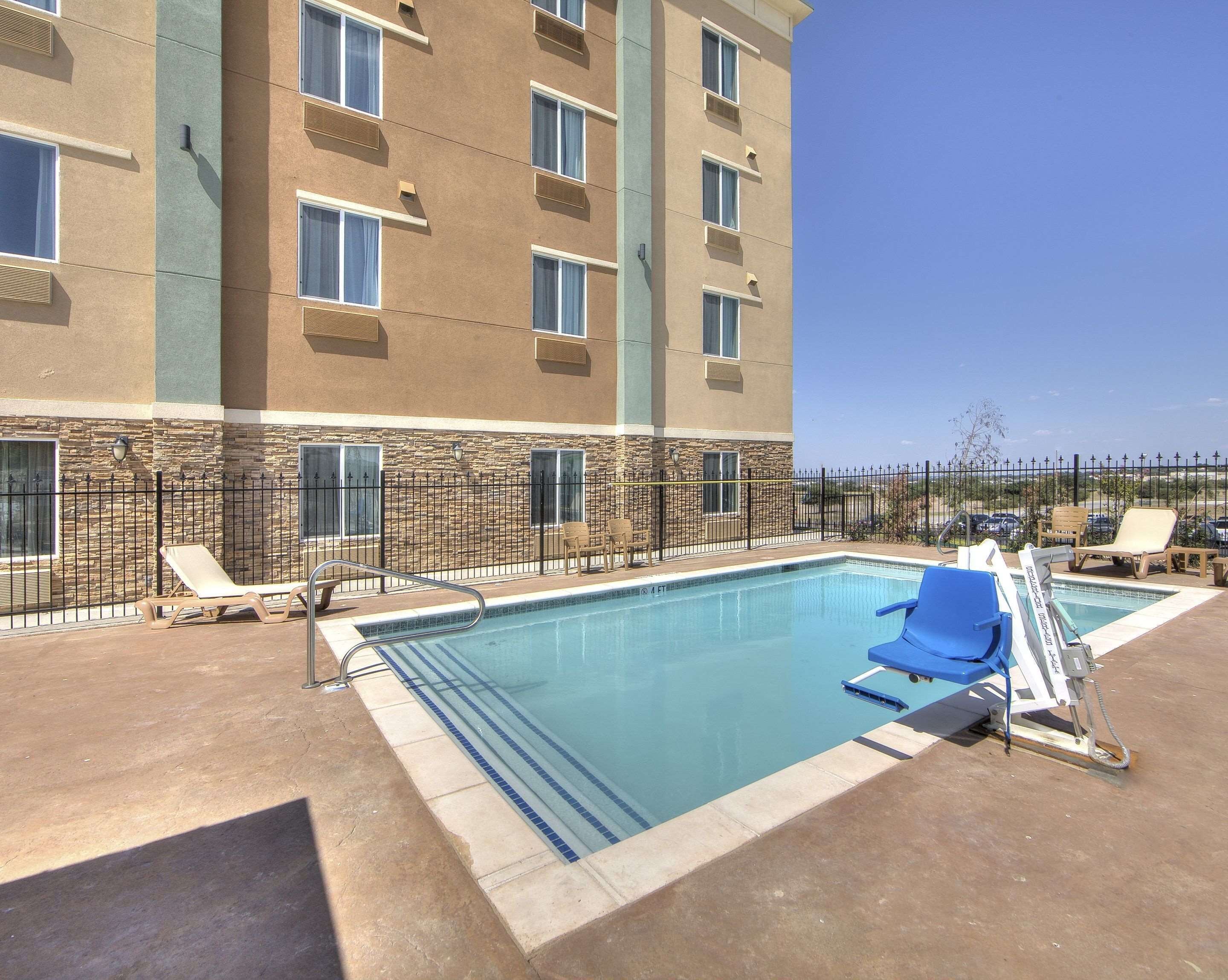 Seasonal outdoor pool, open 10:00 AM to 10:00 PM, pool umbrellas