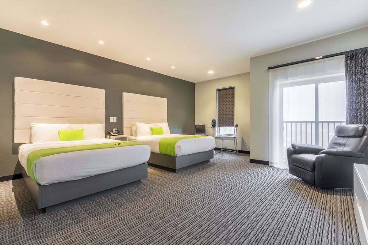 Premium bedding, desk, laptop workspace, blackout curtains