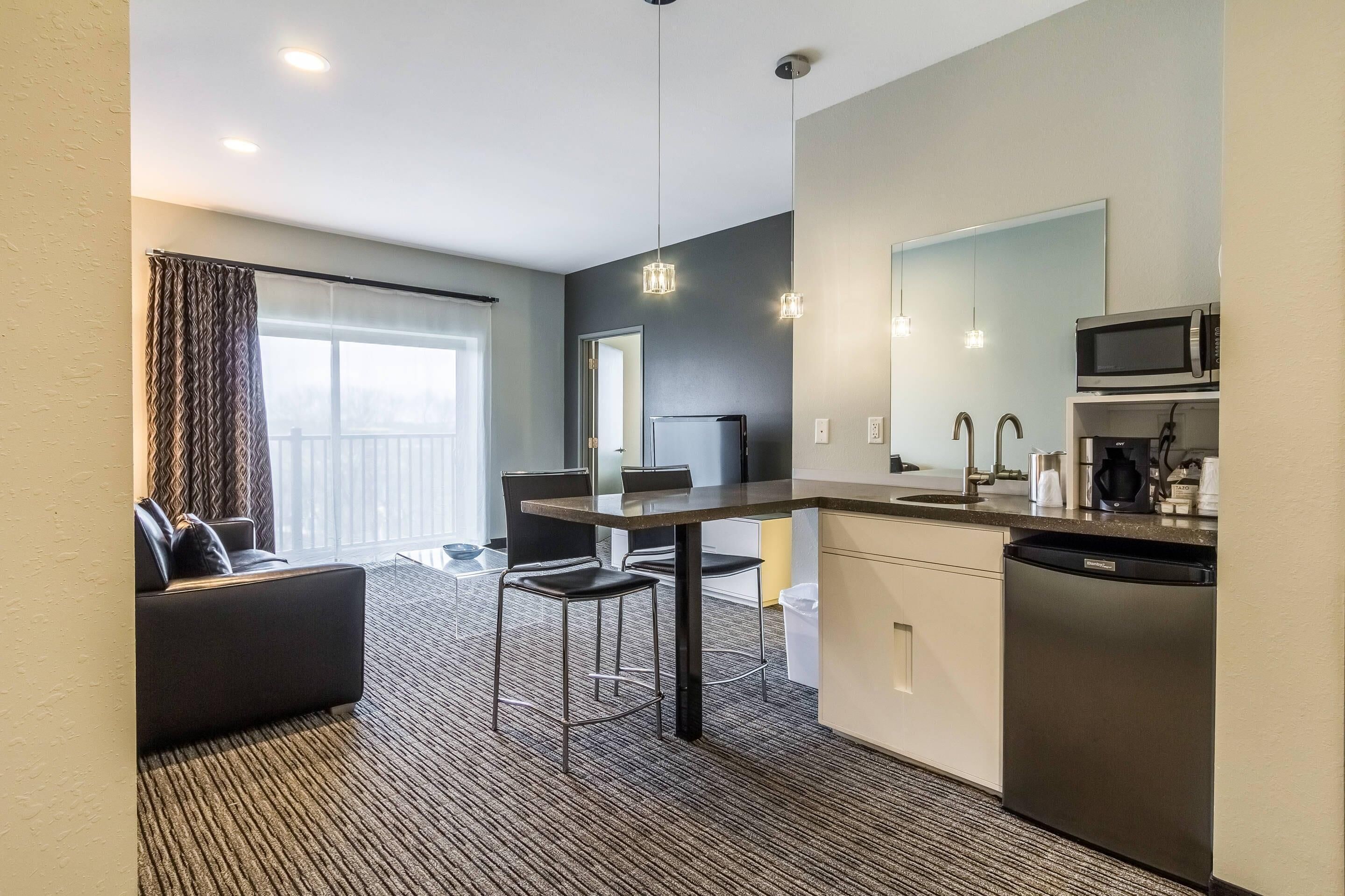 Premium bedding, desk, laptop workspace, blackout drapes