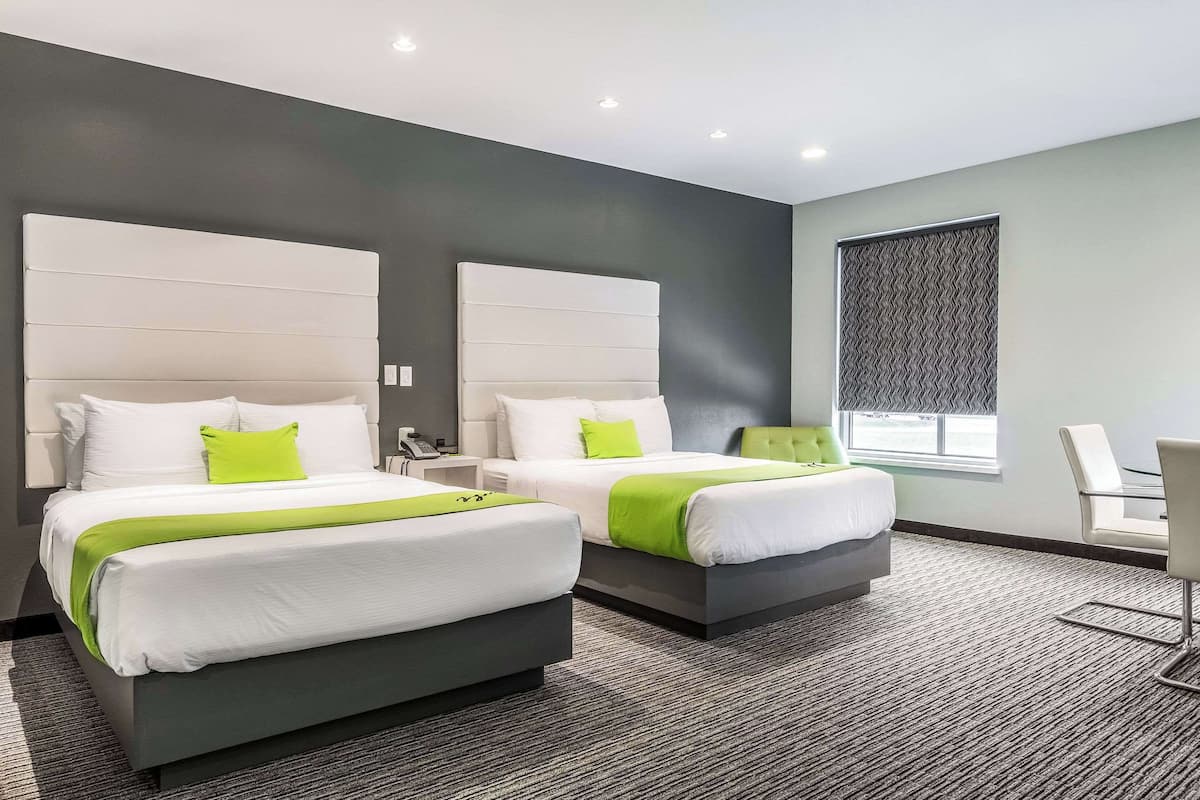 Premium bedding, desk, laptop workspace, blackout curtains