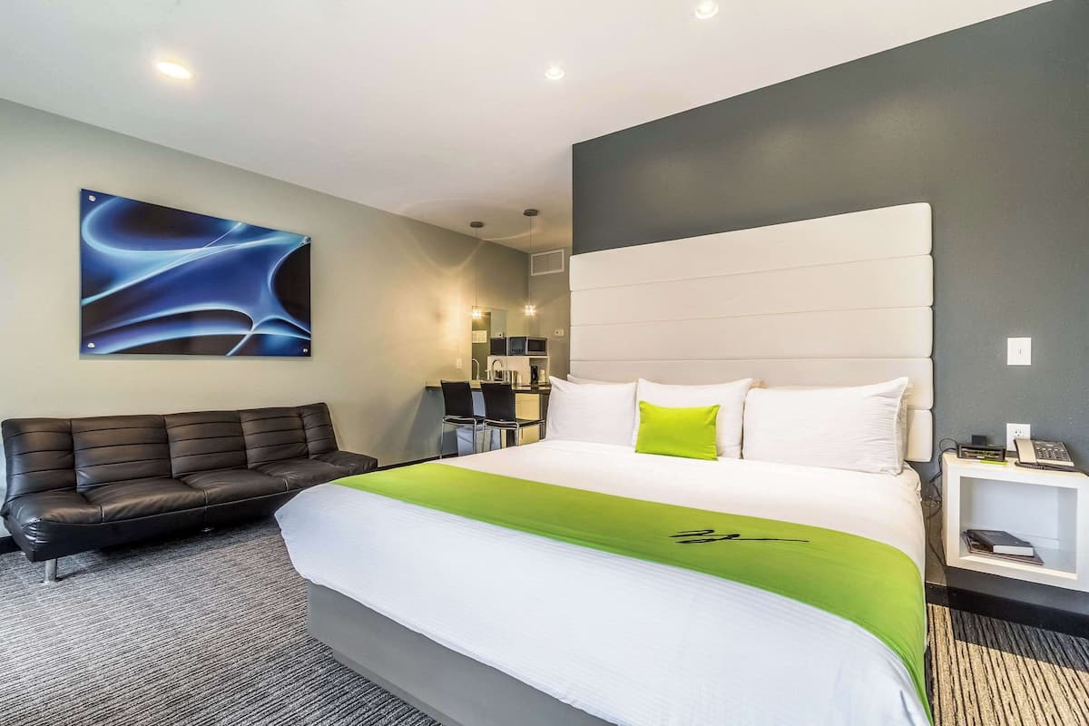 Premium bedding, desk, laptop workspace, blackout curtains