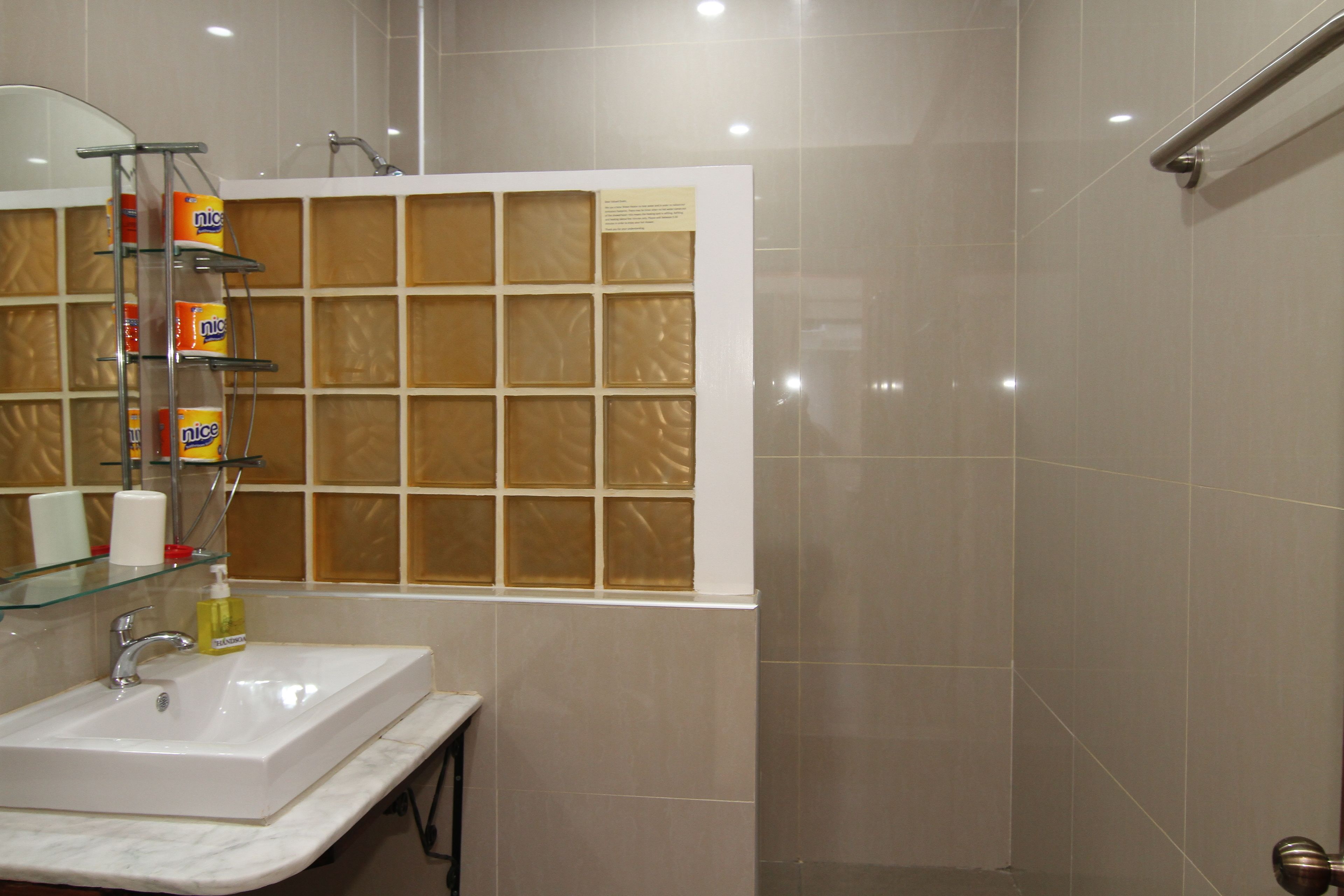 deluxe room | bathroom | shower, rainfall showerhead, hair dryer, bidet