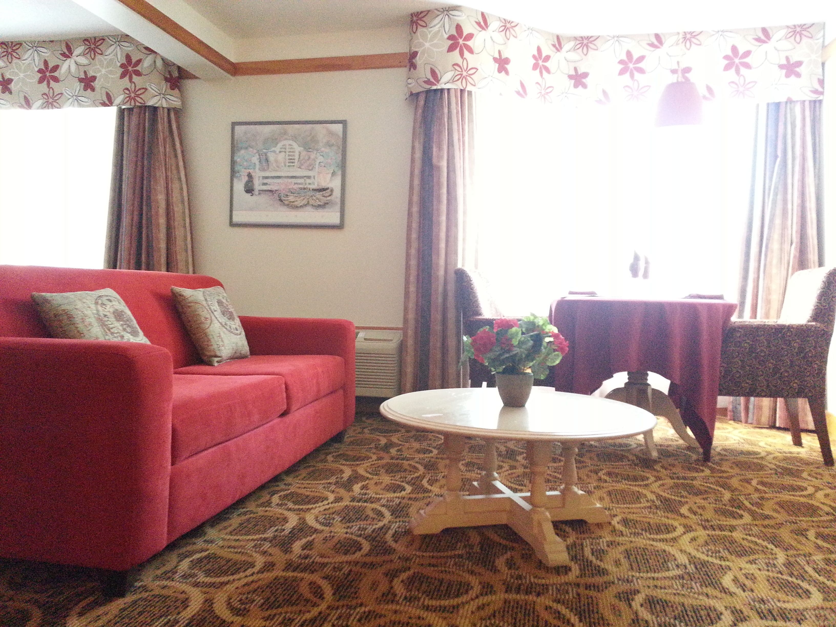 suite, 1 king bed with sofa bed | living area | 32-inch tv with cable channels