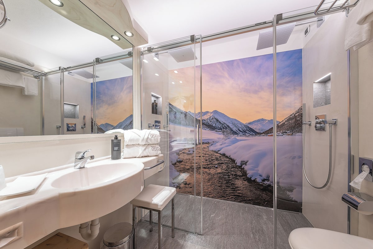 comfort room | bathroom | hair dryer, bathrobes, slippers, bidet