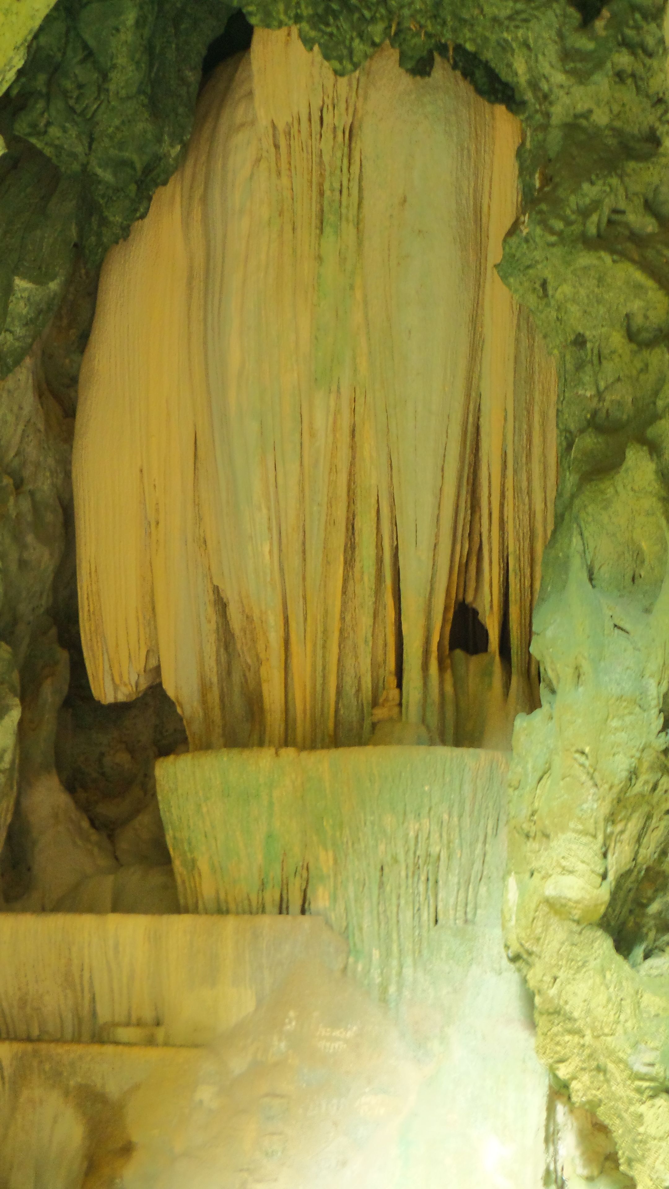 A cave interior with stalactites and stalagmites.