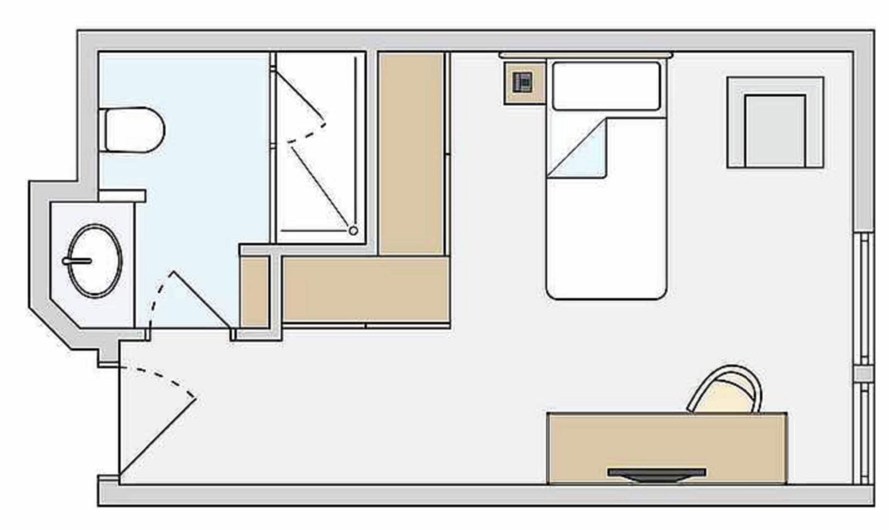 A floor plan with a bathroom, kitchenette, and a small sitting area.