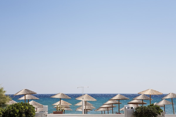 On the beach, sun loungers, beach umbrellas, beach towels