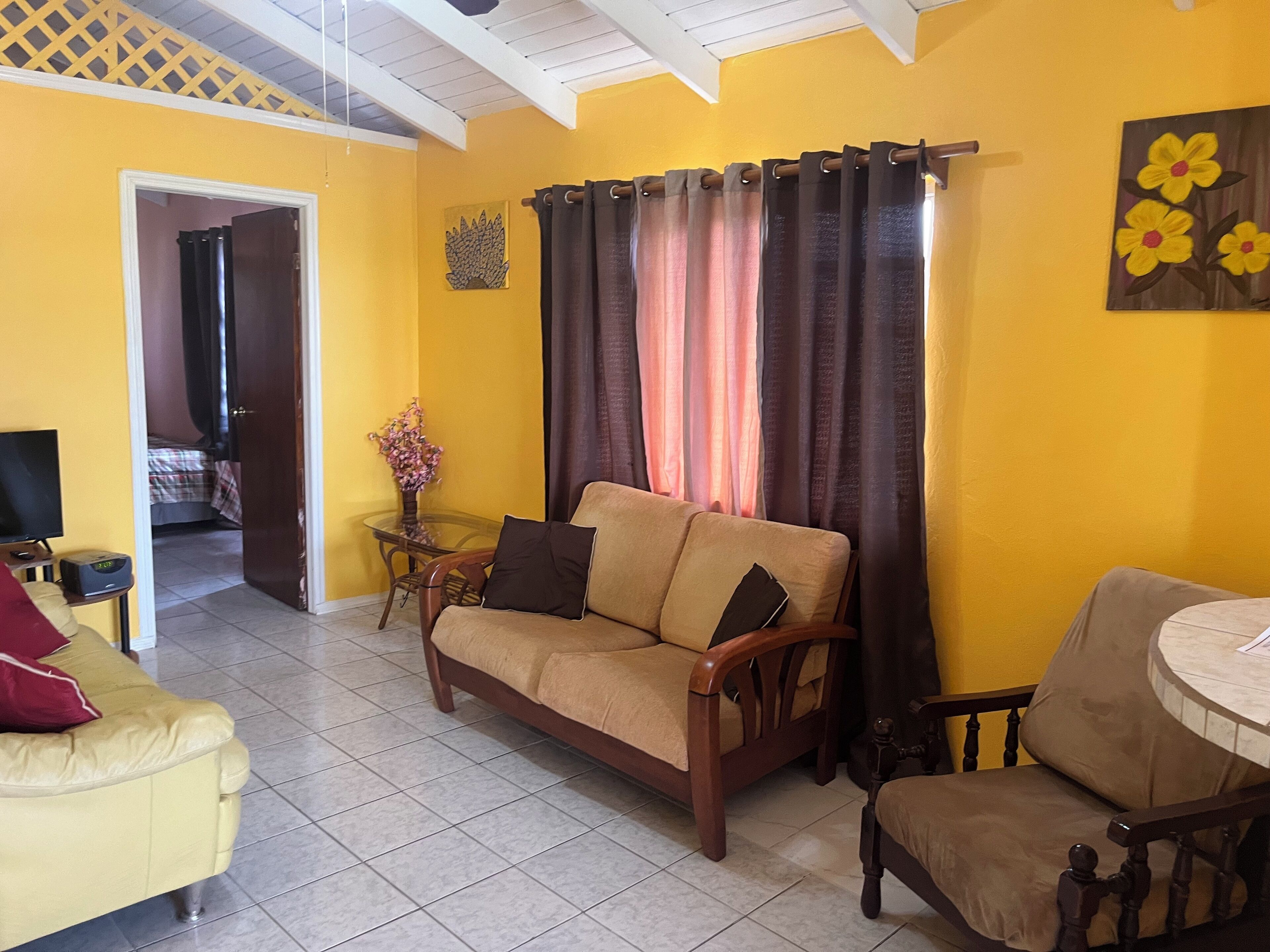 2 Bedroom Apartment | Living area | Flat-screen TV