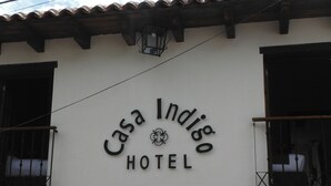 A sign for Casa Indigo Hotel.
