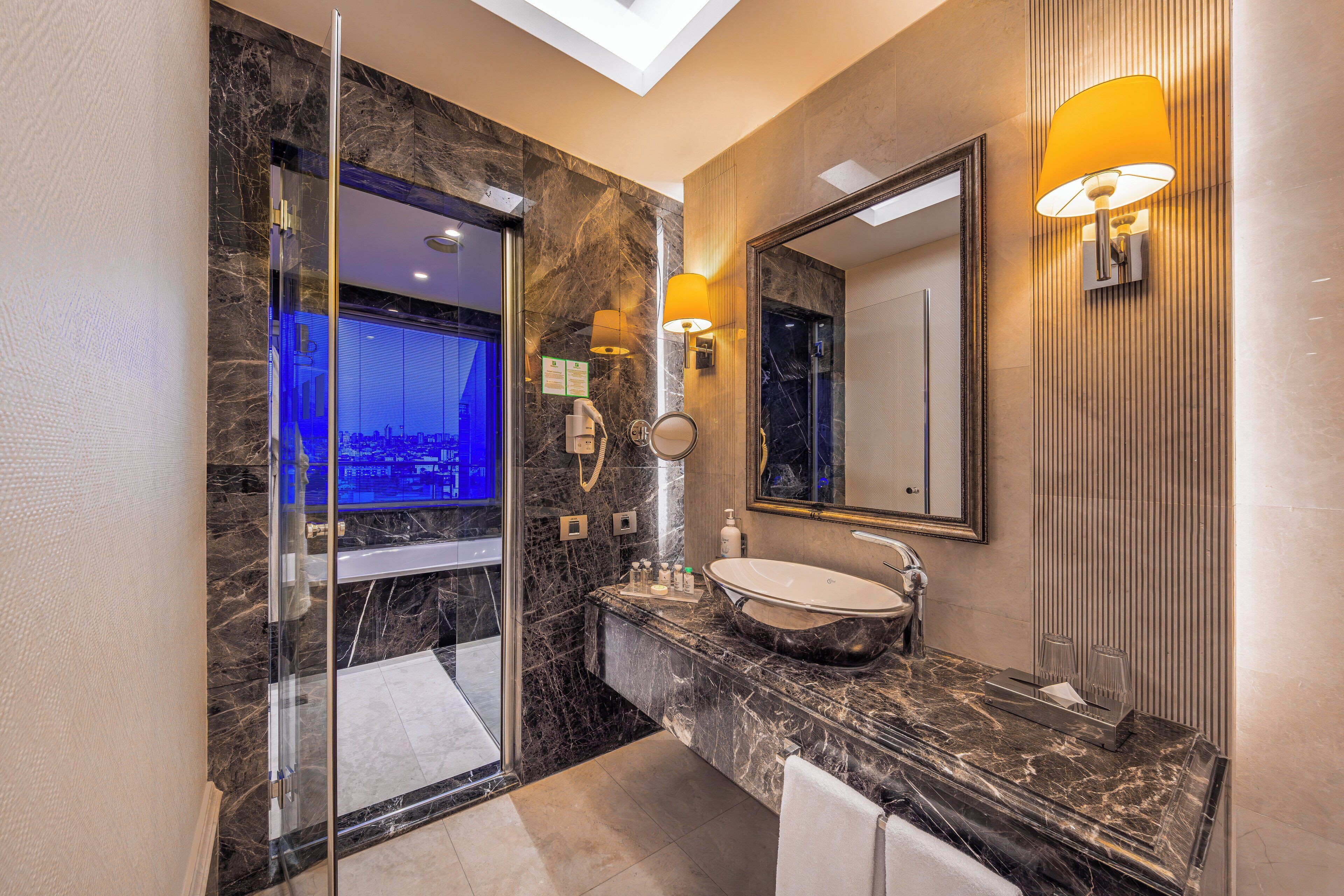 suite, 1 king bed, smoking, jetted tub | bathroom | free toiletries, hair dryer, slippers, towels