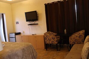 Suite tradicional, 1 cama King size | Tabla de planchar con plancha, wifi gratis y ropa de cama 