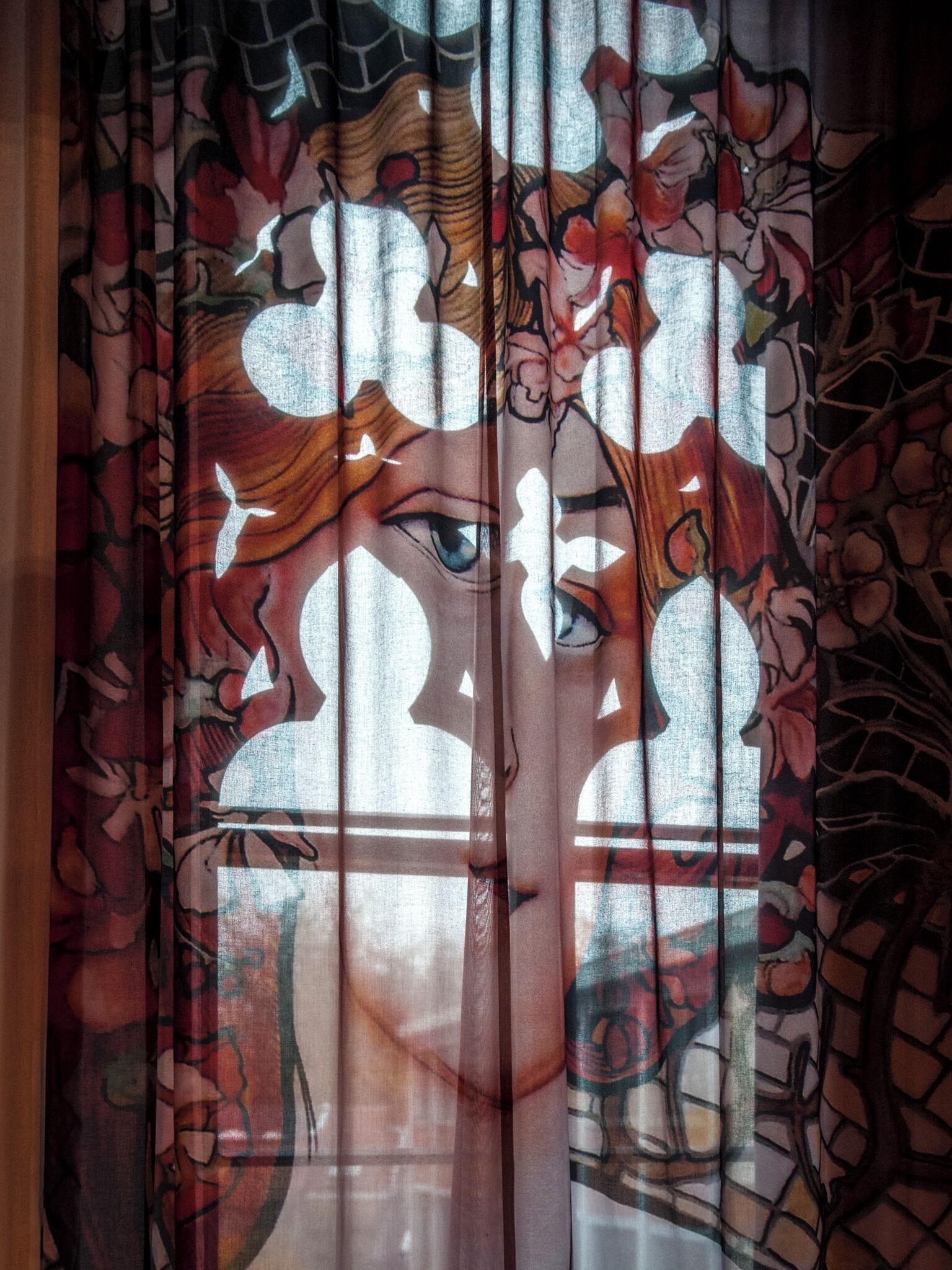 A window with a floral pattern.