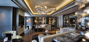 A modern hotel lobby with a marble reception desk, comfortable seating areas, and a large chandelier. - JW Marriott Hotel Zhengzhou (Zhengzhou)