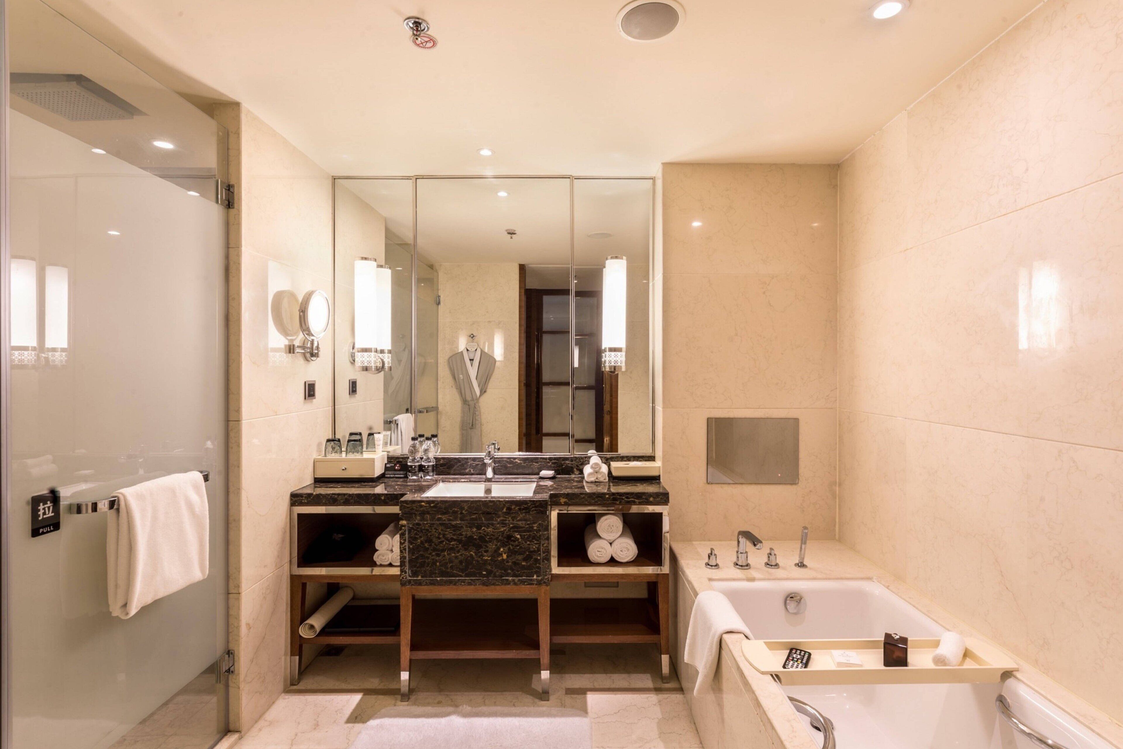 executive studio suite, 1 king bed | bathroom | separate bathtub and shower, free toiletries, hair dryer, bathrobes