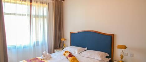 Premium bedding, pillowtop beds, minibar, in-room safe