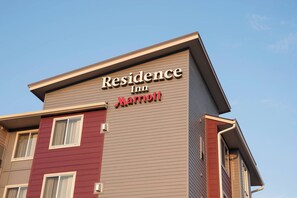 A building with a sign that reads "Residence Inn Marriott."