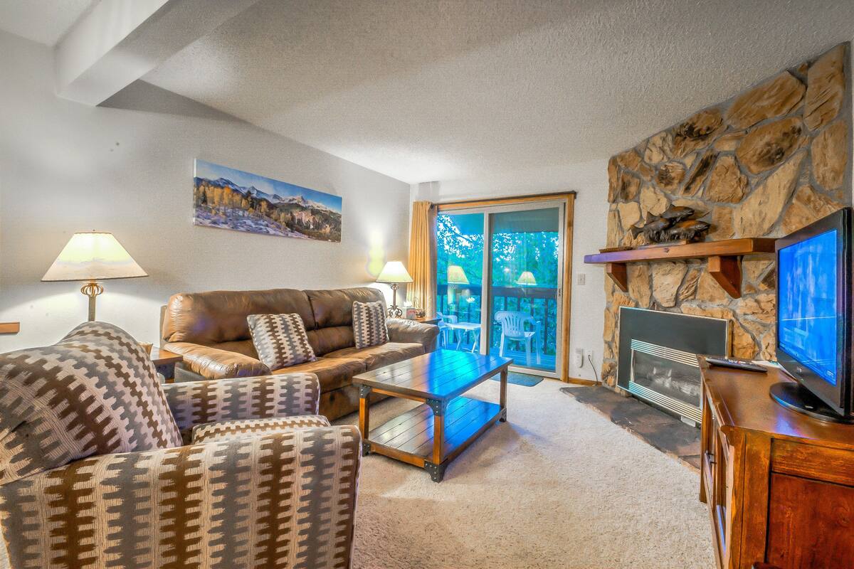 2 Bedroom, 2 Bathroom - E 303 | Living area | Flat-screen TV, fireplace
