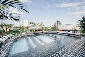Outdoor pool, open 6:00 AM to 9:00 PM, pool loungers