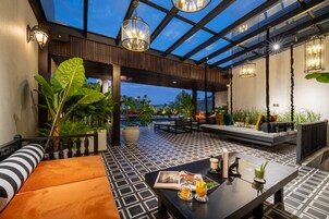 Outdoor pool, open 6:00 AM to 9:00 PM, pool loungers