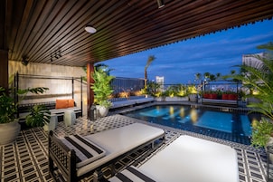 Outdoor pool, open 6:00 AM to 9:00 PM, sun loungers