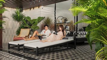 Outdoor pool, open 6:00 AM to 9:00 PM, pool loungers