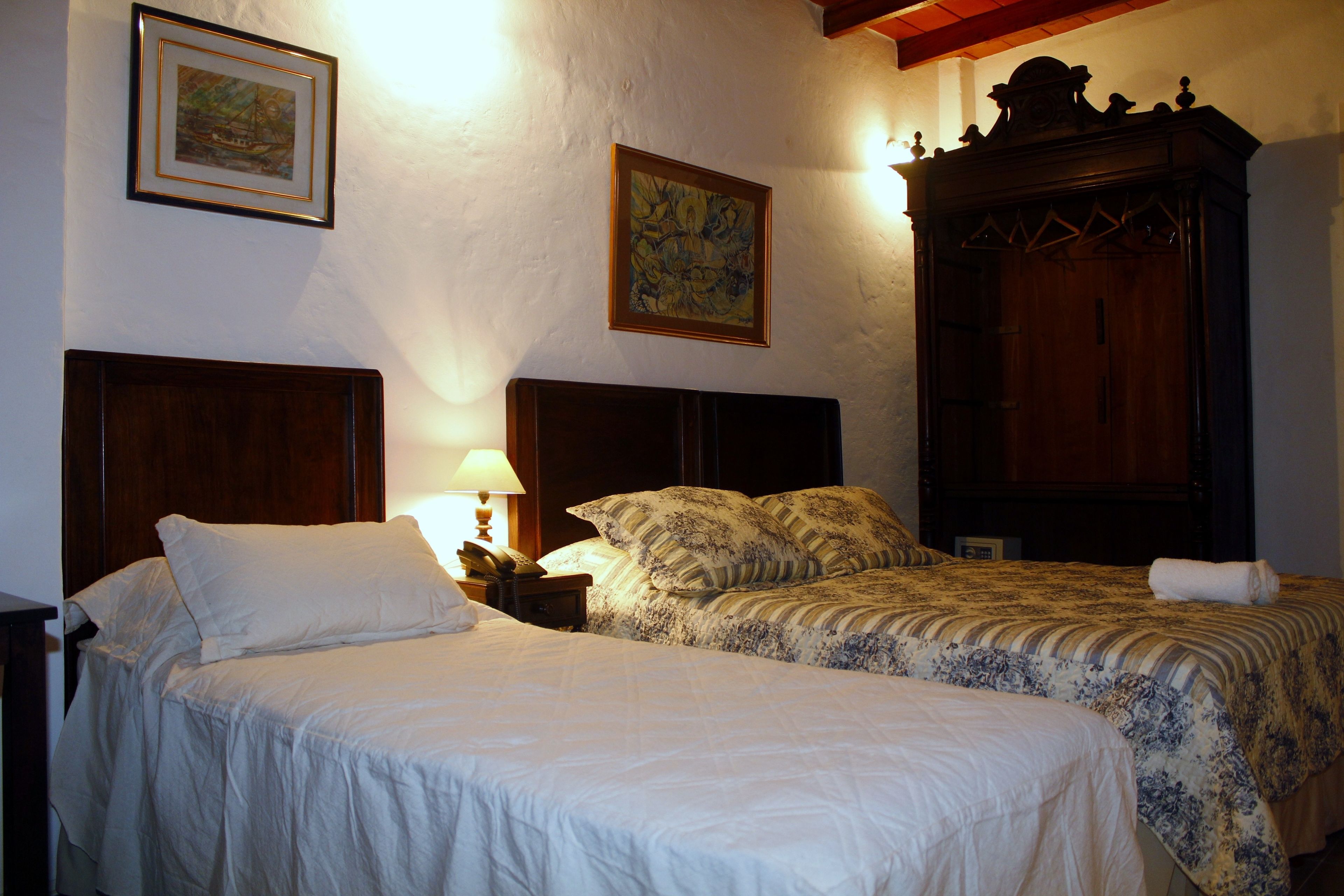 triple room | minibar, in-room safe, individually decorated, desk