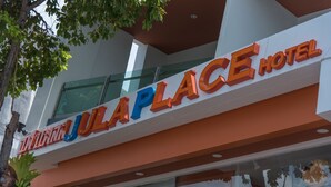 The exterior of the Jula Place Hotel with a prominent sign displaying its name. - Phuket Jula Place (Chalong)