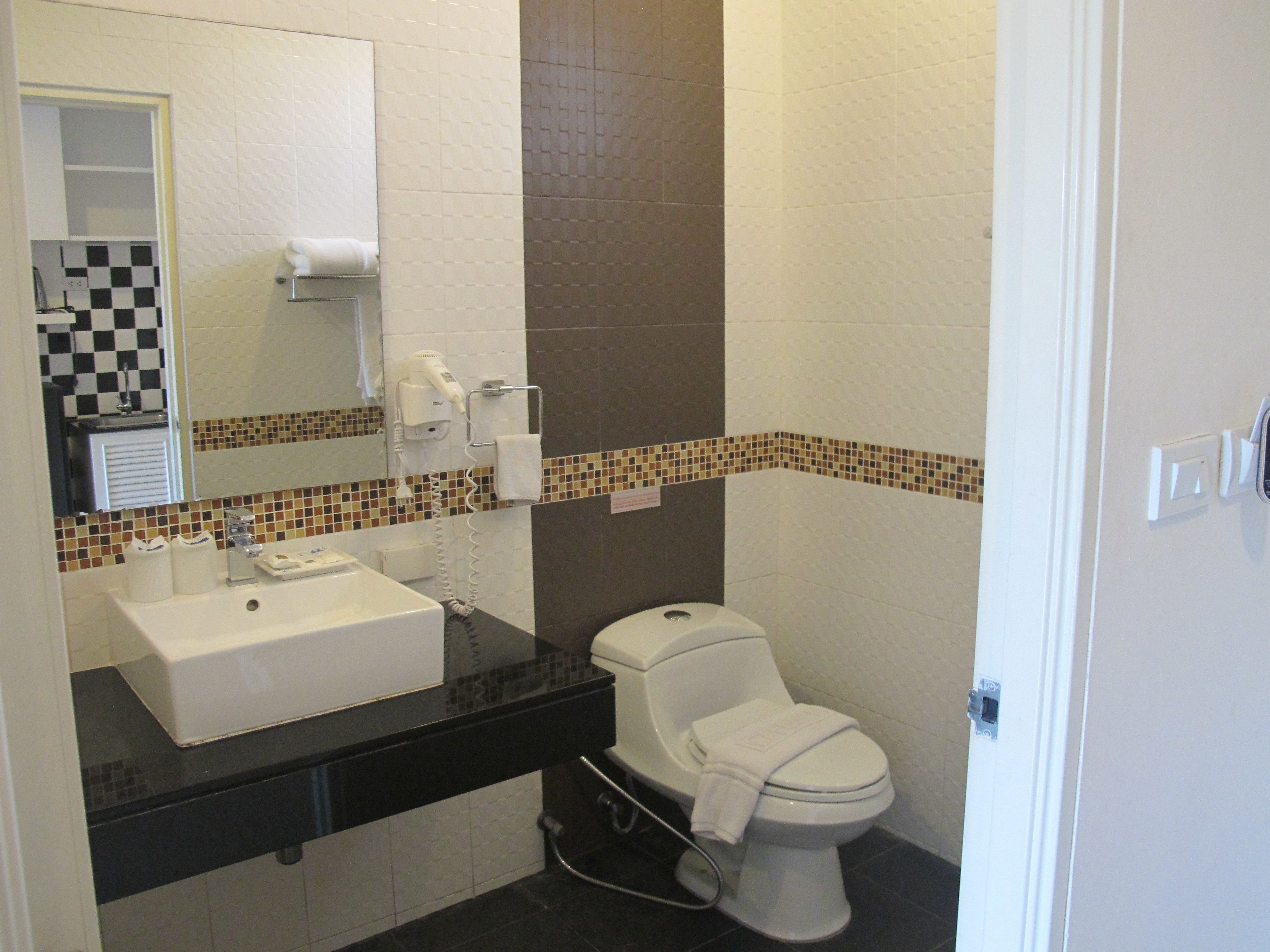 superior room | bathroom | shower, hair dryer, towels