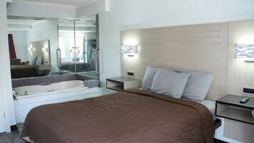 Suite, 1 Queen Bed, Jetted Tub | Desk, free WiFi, bed sheets