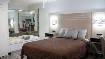 Suite, 1 Queen Bed, Jetted Tub | Desk, free WiFi, bed sheets
