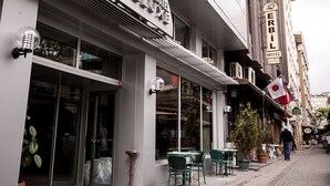 A hotel with a modern facade, outdoor seating, and a visible entrance. - Viva Deluxe Hotel (Istanbul)