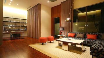 Garden view Suites | Living area | 42-inch plasma TV with cable channels, TV, DVD player