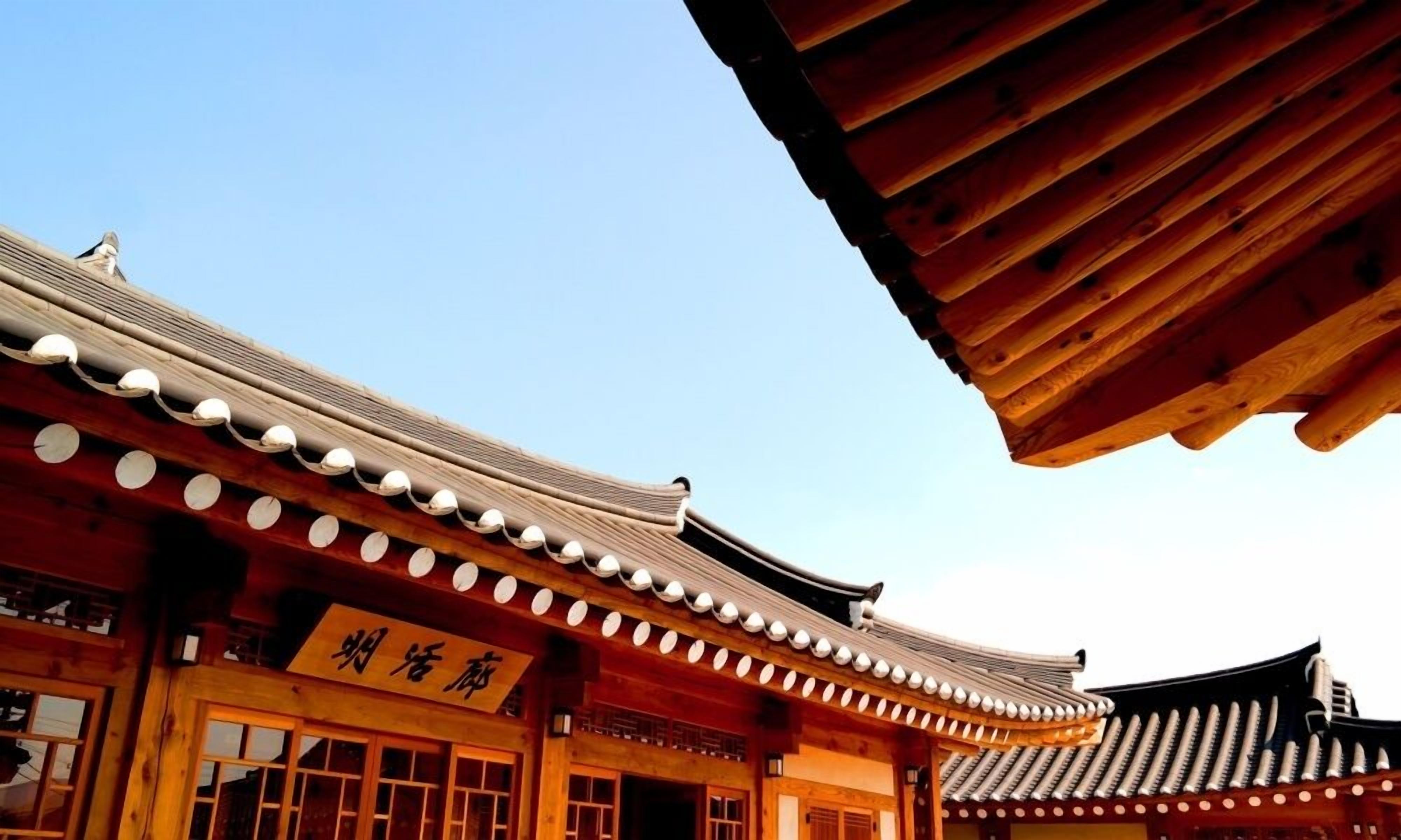A traditional building with a tiled roof and wooden beams.