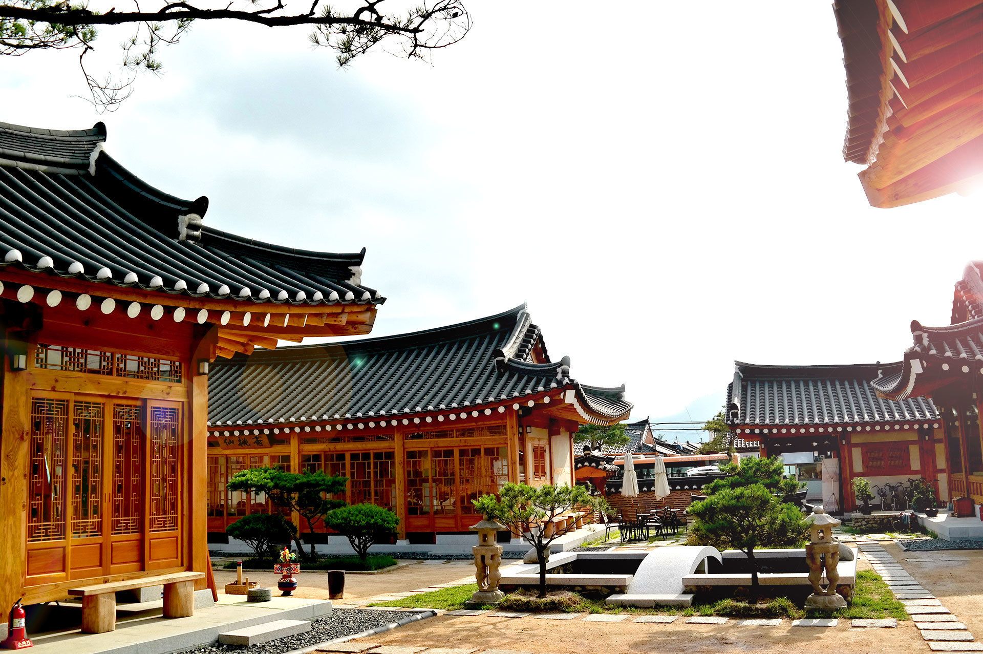 A traditional building with a tiled roof and wooden structures.