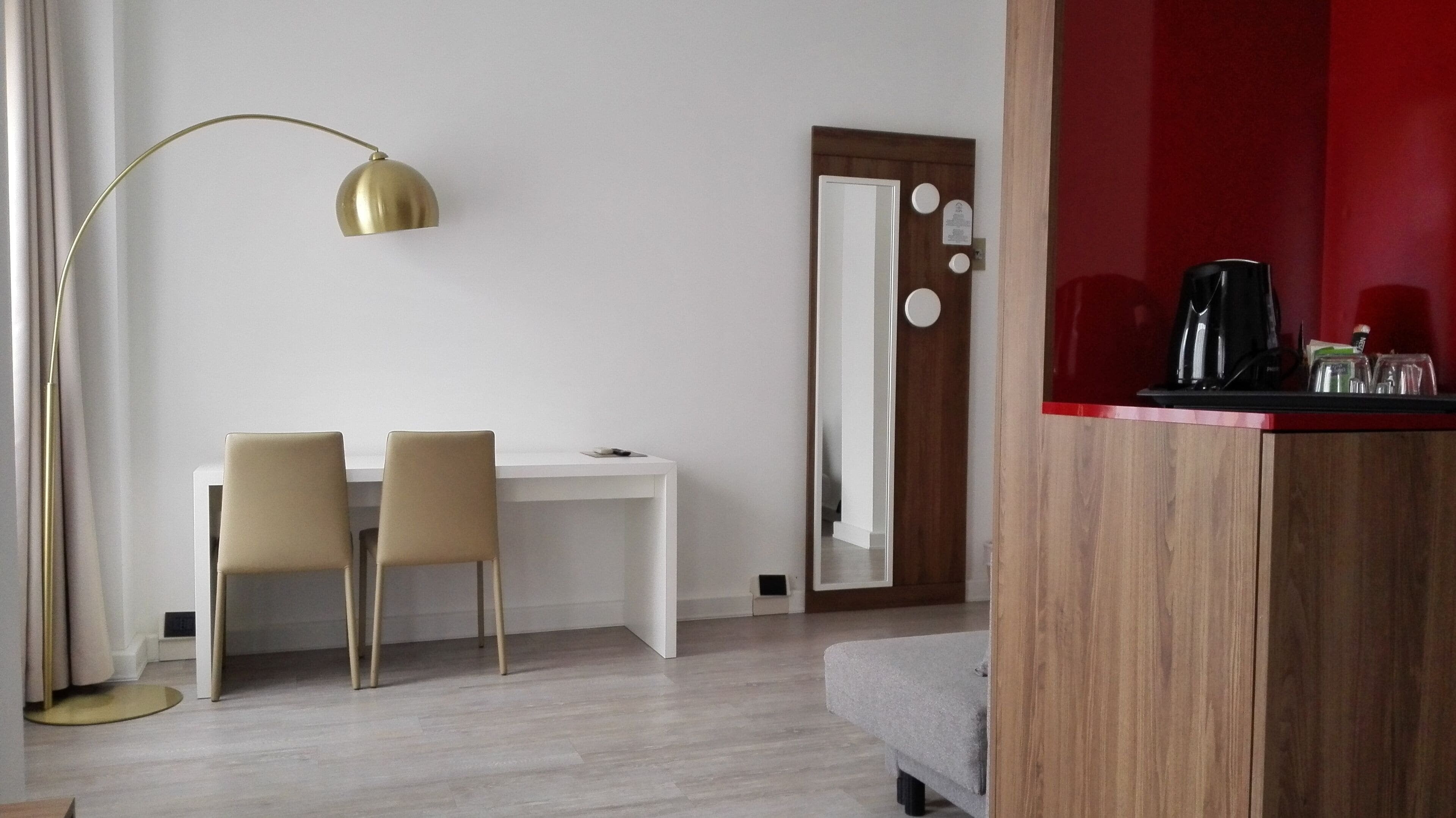 junior suite | in-room safe, desk, blackout curtains, iron/ironing board