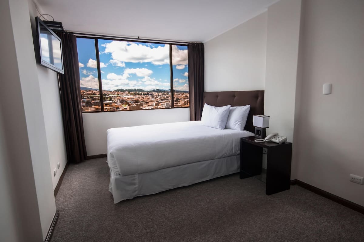 Premium bedding, down duvets, desk, laptop workspace
