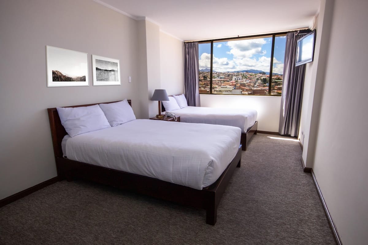 Premium bedding, down duvets, desk, laptop workspace