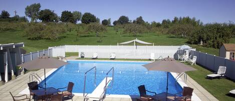 Seasonal outdoor pool, open 10:30 AM to 7:00 PM, pool umbrellas