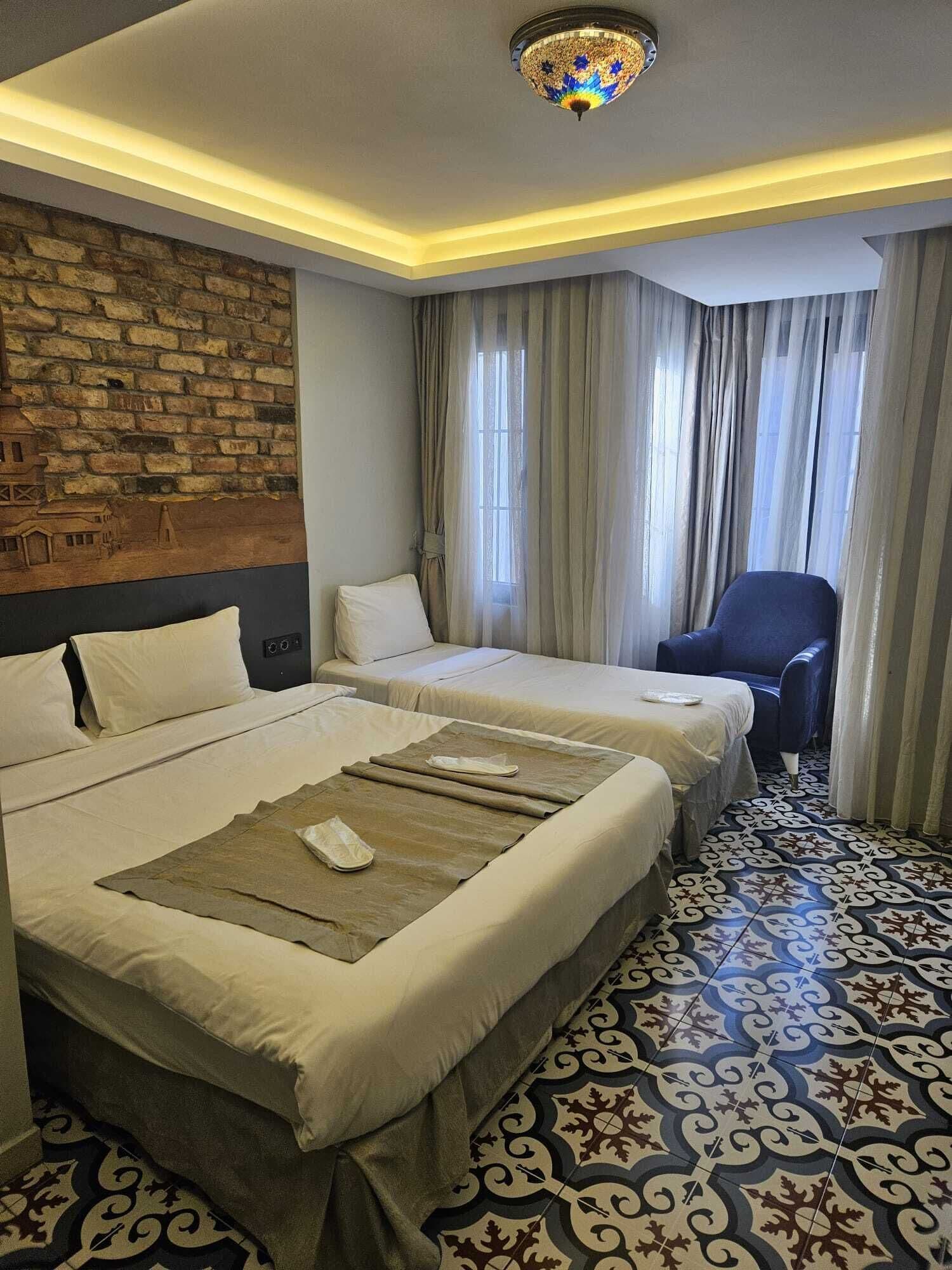 Quarto triplo superior | Frigobar, cofres nos quartos, quartos à prova de som, Wi-Fi de cortesia