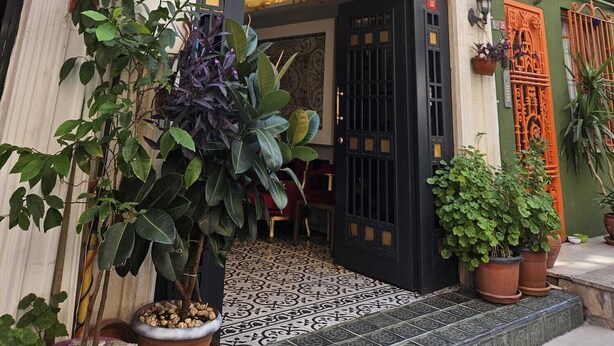 A building with a sign reading 'A PLUS Residence' and a door with a black gate. - A Plus Residence (Istanbul)