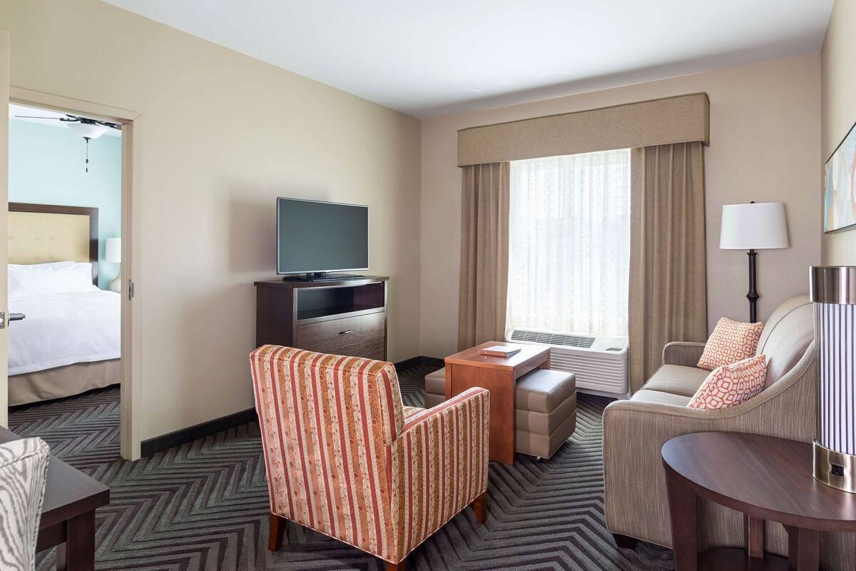 Down comforters, desk, blackout drapes, iron/ironing board