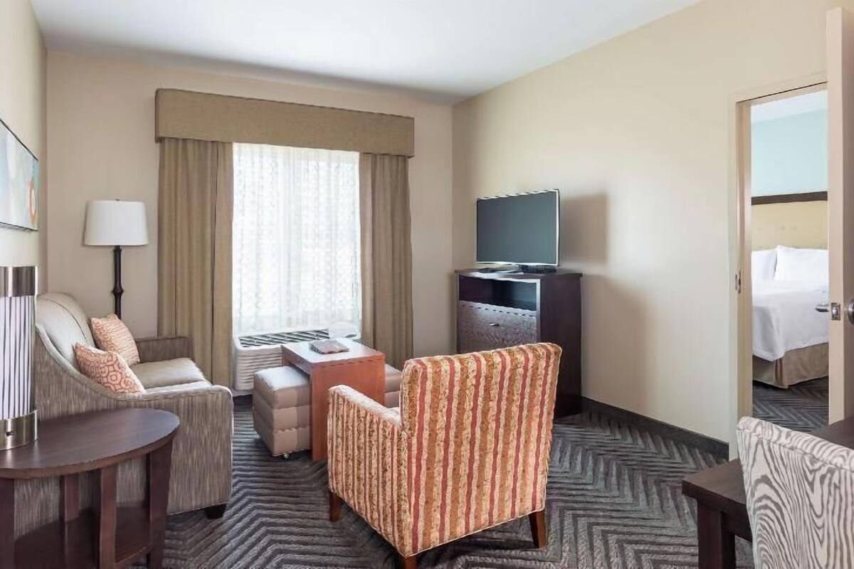 Down comforters, desk, blackout drapes, iron/ironing board