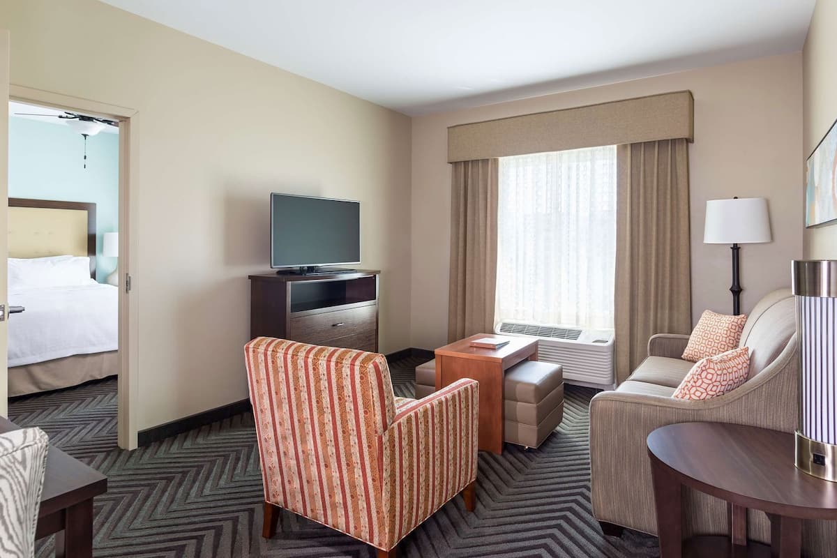 Down comforters, desk, blackout drapes, iron/ironing board