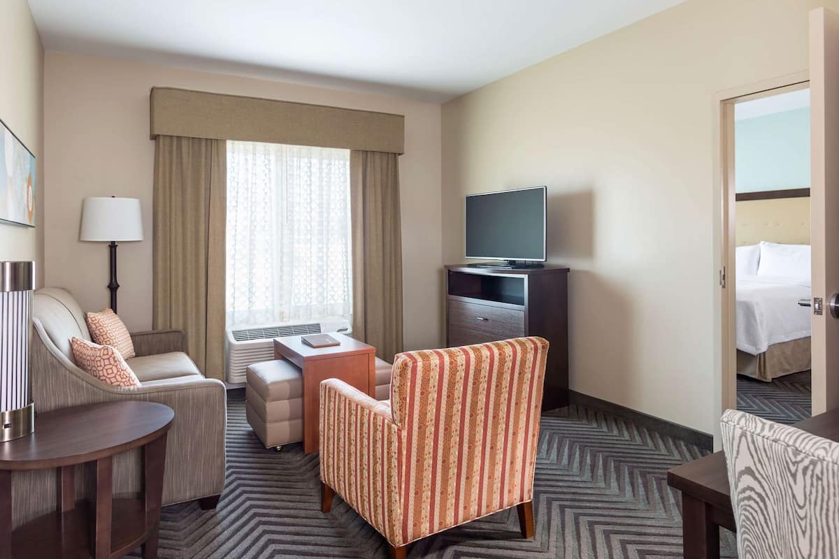 Down comforters, desk, blackout drapes, iron/ironing board